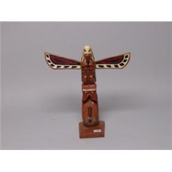 Carved Totem Pole by Tom Hunter