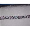 Image 2 : BRACELET - 6CTW (12) LIVELY BLUE TOPAZS & DIAMOND IN STERLING SILVER CROSS OVER LINK DESIGN SETTING