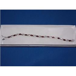 BRACELET - 12 OVAL FACETED RICH DEEP RED/BROWN GARNETS IN STERLING SILVER CROSS OVER LINK DESIGN SET