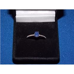 RING - OVAL FACETED BLUE SAPPHIRE & 2 DIAMONDS IN STERLING SILVER SOLITAIRE DESIGNED SETTING - RETAI