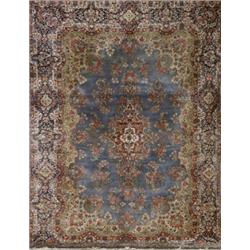 Kerman Rug, Second Quarter 20th Century, Blue ground with floral trellising vine field center...