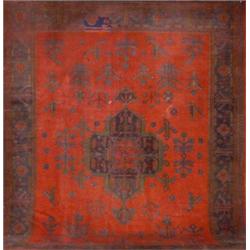 Oushak Rug, Second Quarter 20th Century, Red ground with flowering tree field centering a cru...