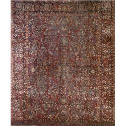 Sarouk Rug, Second Quarter 20th Century, Red ground with floral spray field within a palmette...