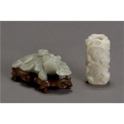 Two Chinese Jade Carvings, 19th Century, The first, a pale celadon chimera-form taper stick h...