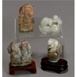 Group of Nine Chinese Jade and Jadeite Carvings, 19th-20th Century, Depicting boys, a figure...