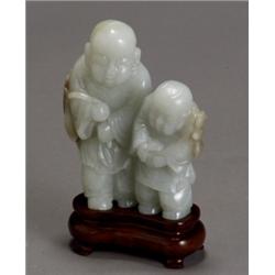 Chinese Russet Light Celadon Jade, Group of Two Boys, 20th Century, Height: 5 in (12.7 cm)...