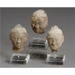 Group of Five Chinese Painted Gray Pottery Heads of Guardians, Sui-Tang Dynasty (581-907 A.D.)...