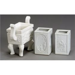 Two Chinese Molded White Glazed Brush Pots and a Ding-Form Censer, 19th Century, The first br...