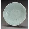 Image 1 : Chinese Celadon Glazed Charger, 19th Century, The interior carved with lotus scrolls. Some gl...