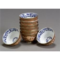 Set of Eight Arita Gilt and Iron-Red 'Dragon' Bowls, Meiji Period (1868-1912), Each with unde...