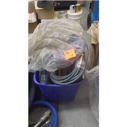 Tub full of steam cleaner hose