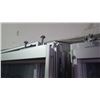 Image 3 : Approximately 9 glass panels/sliding doors with aluminum frames on rollers
