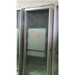 Approximately 6 glass panels/sliding doors with aluminum frames on rollers