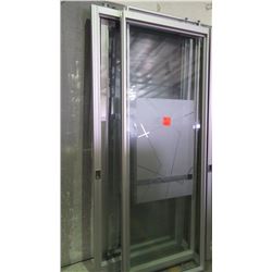 Approximately 5 glass panels/sliding doors with aluminum frames on rollers
