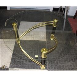 VINTAGE ROUND BLACK AND GLASS COFFEE TABLE