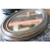 Image 1 : PAIR OF FRAMED OVAL MIRRORS