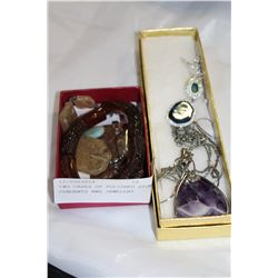 TWO CASES OF POLISHED STONE PENDANTS AND JEWELLRY