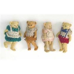 A set of four miniature Teddy bears, fully-jointed china bodies, clothed in hand-woven outfits, a...