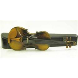 A late 19th century violin bearing the label of Jacobus Stainer, with 14in. two piece back, brown...