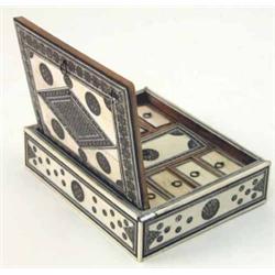 A Syrian ivory trinket box, with geometric inlay, the lid enclosing an interior of nine compartme...