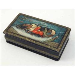 A Russian papier mache lacquer box, decorated with three horses pulling a carriage within a storm...