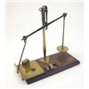 Image 1 : A set of brass postal scales by Degrave Short & Fanner, with four loose block weights on mahogany...
