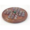 Image 1 : An English solitaire set, comprising thirty-two colour twist glass marbles and flecked green cent...