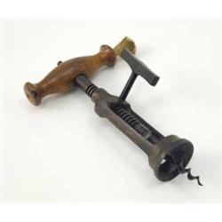 An English 19th century corkscrew in the manner of Thomas Lund of London, with turned wood handle...