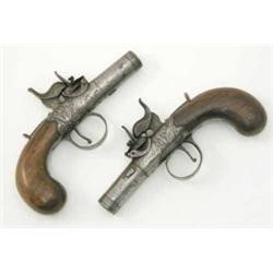 A pair of top hat percussion pistols by C Parker, with short tapering engraved barrels, engraved...