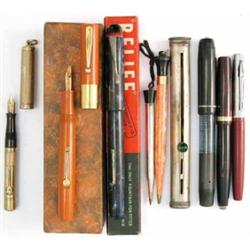 A collection of five fountain pens, to include a Watermans gold pen, a further Watermans pen with...