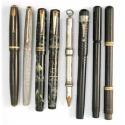 A collection of eight pens/pencils, to include a Parker Duofold and silver fountain pen, a Swan L...