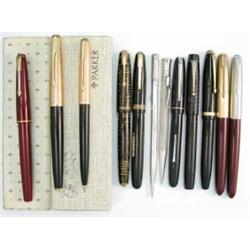 A red Parker 17 in case, a cased Parker pen set with gold lids, a further Parker Vacumatic founta...