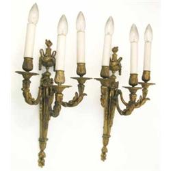 A set of four gilt metal three branch wall lights, of Adam design, each foliate sconce arm leadin...