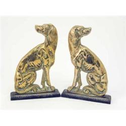 A pair of cast brass hound door porters, modelled in opposite positions; the dog ‘sitting’ with h...