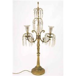 An ormolu standard lamp and four wall lights, lamp cast with a dolphin supporting two scroll scon...