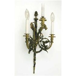 A good set of six ribbon-crest ormolu three branch wall lights, each cast with a central scroll a...