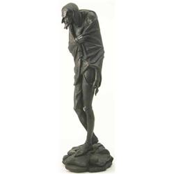 A cast iron figure of Mephistopheles, on rocky base, which bears signature J.Gautier, 2ft 5ins...