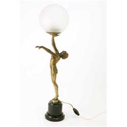 An Art Deco bronzed spelter table lamp with glass globe and female stem, on marble base, 27 ins....