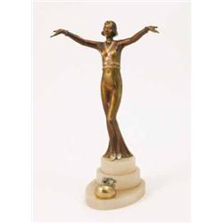 An Art Deco bronzed spelter figure of a female, modelled in period dress with arms outstretched o...