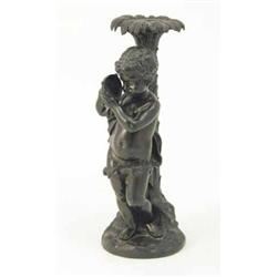 A cast bronze figure of a putto, the draped putto with tambourine leaning against a hollow palm t...