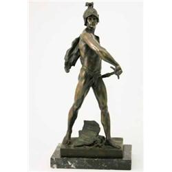 A bronze figure of a gladiator, drawing his sword, signed E.Picault, on marble rectangular base,...