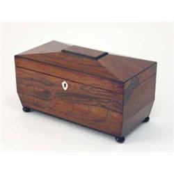 A Regency rosewood two-drawer tea caddy, on ball feet, 12ins...