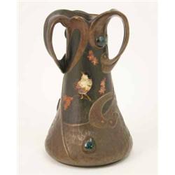 A Bretby simulated bronze vase in Art Nouveau style painted with a bird and mounted with ceramic...