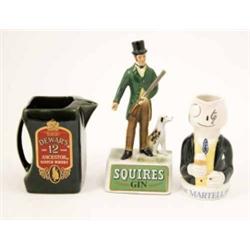 Three ceramic advertising ornaments, ‘Squires Gin’ huntsman with dog (10in.), ‘Martell’ character...