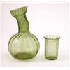 Image 1 : A pair of green glass carafes, with ribbed moulding (8in.) and three tumblers en suite...