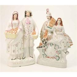 Two Victorian Staffordshire pottery figure groups, one entitled ‘Orange Sellers’ (14in.), the oth...