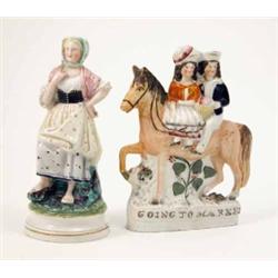 A Victorian Staffordshire pottery figure group, “Going to Market”, male and female seated on hors...