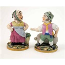A pair of French porcelain pastille burner figures, comical, dwarf-like characters, male standing...