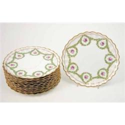 A set of twelve Copeland bone china dessert plates, painted with leaf-garlands and roses, the und...