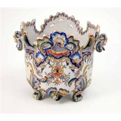 A late 19th century Desvres two-handled jardiniere, with shell-moulded rim, painted with flowers...